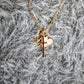 Skinny Cross Charm in Shiny Gold